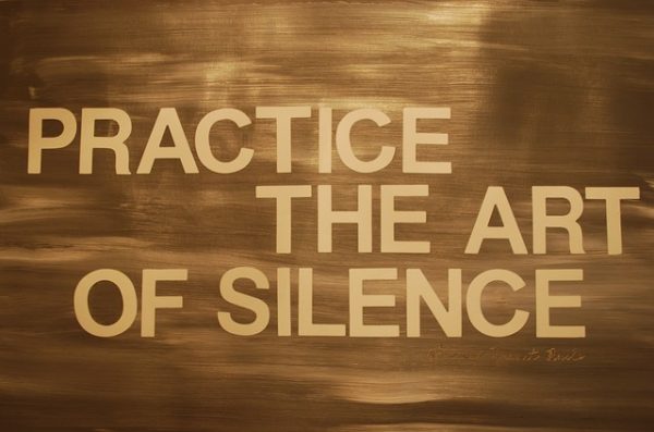 sign saying practice the art of silence