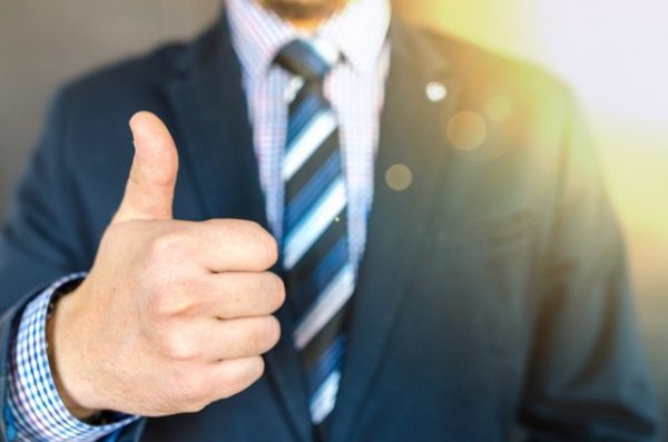 Man giving thumbs up sign - blog about negativity for the positive psychology people
