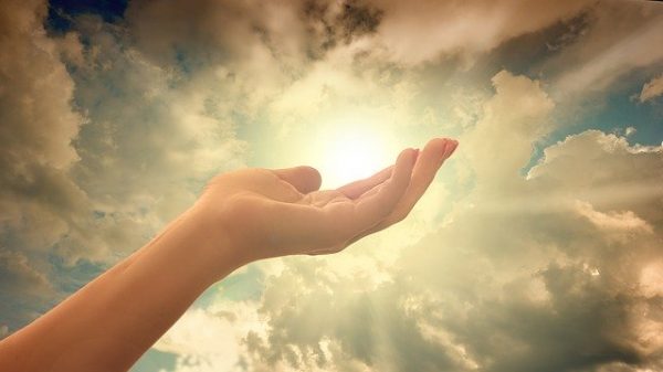 open hand reaching to sky blog on spirituality the positive psychology people