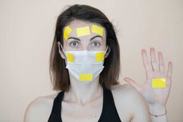 woman in mask and post it notes blog the positive psychology people