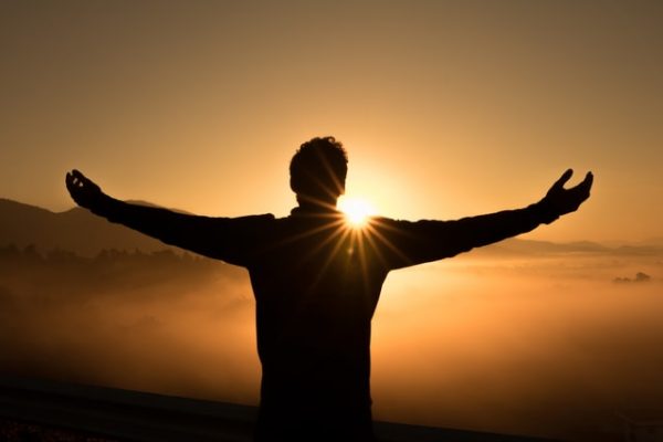 silhouette of man against the sun blog for the positive psychology people