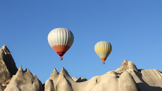 rising hot air balloons representing positive psychology coaching